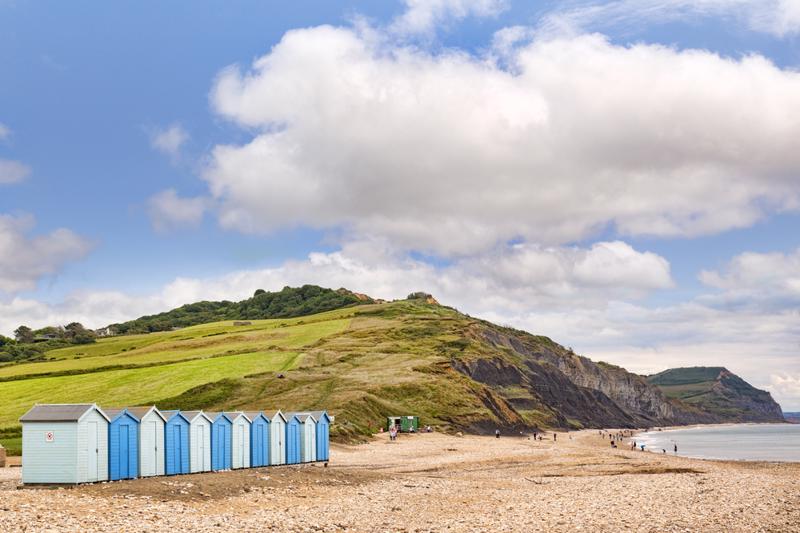 30 June 2017: Charmouth, Dorset, England, UK - The beach in summer, popular with fossil hunters