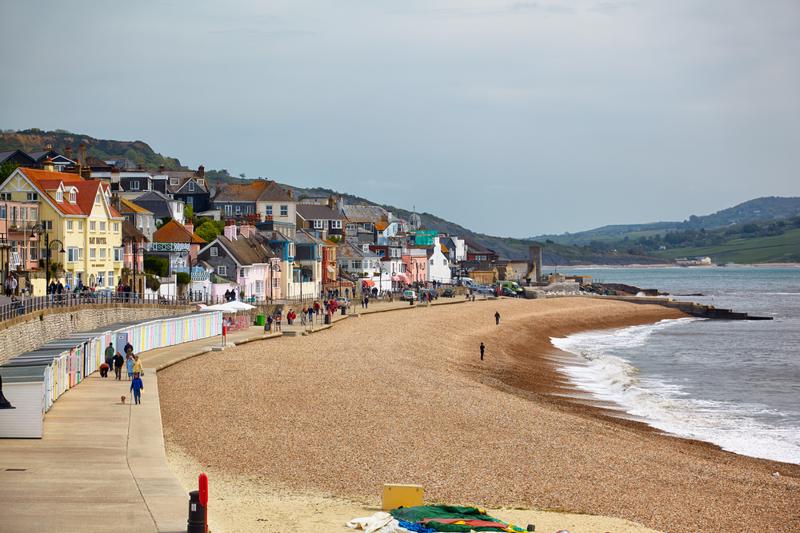 he view of the Lyme Regis Marine Parade – a promenade along the Lyme bay, a part of South West Coast Path. West Dorset. England