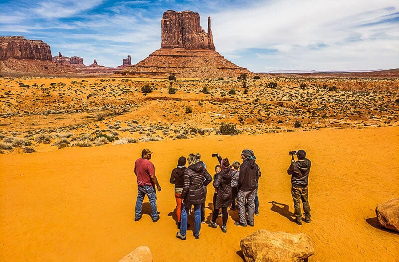 People looking at the mesas at Monument Valley Navajo Tribal Park 