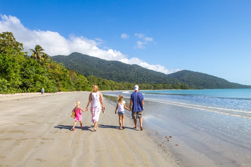 family walking  along Cape Tribulation Beach 