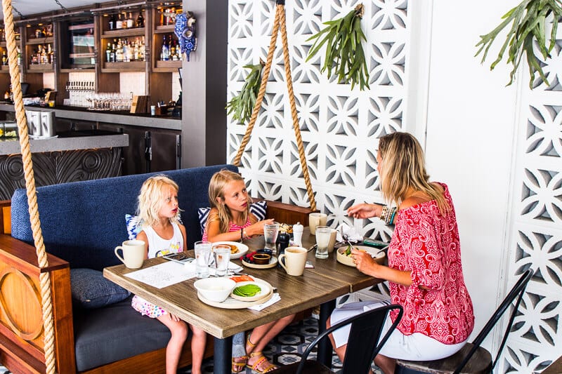 family sitting at table eating