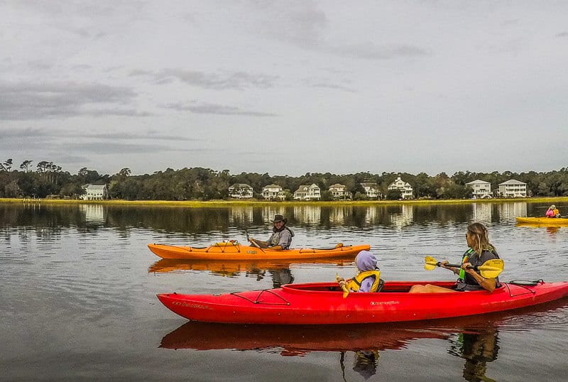 people Kayaking through the Salt Marsh in Huntington Beach State Park