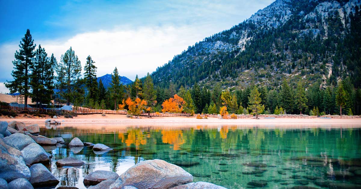 lake surrounded by rocks and trees