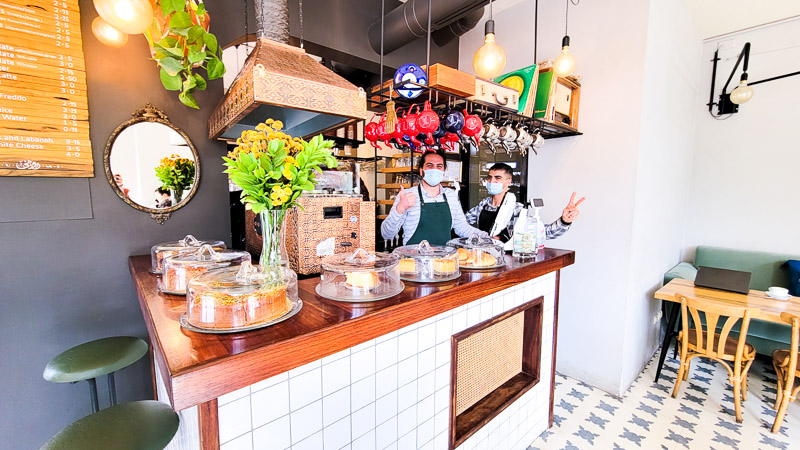 two men at counter of rumi cafe