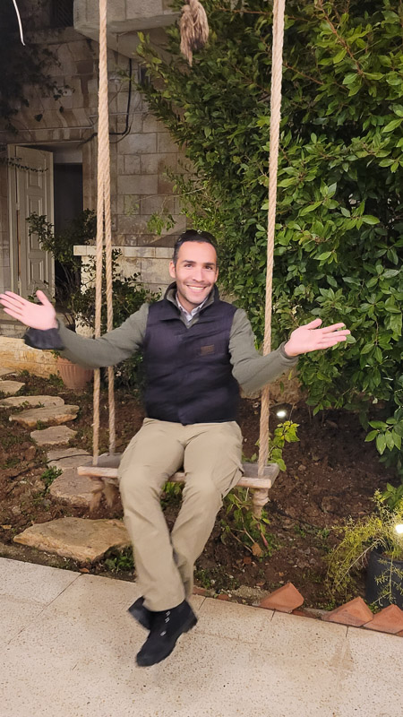 man sitting on swing