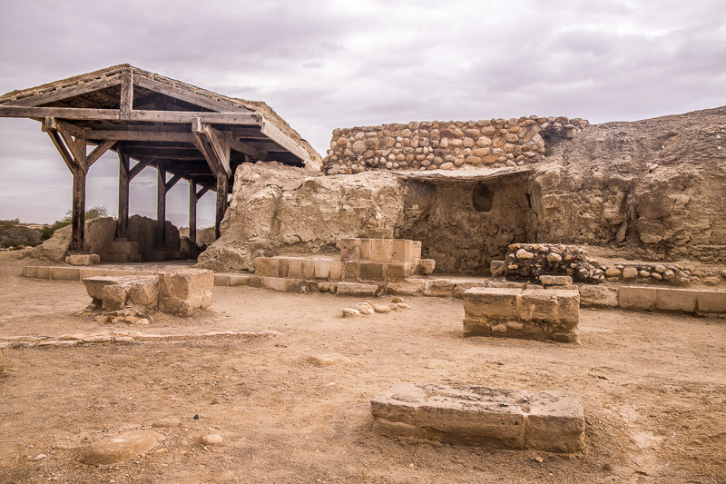 a small cave surrounded by rubble