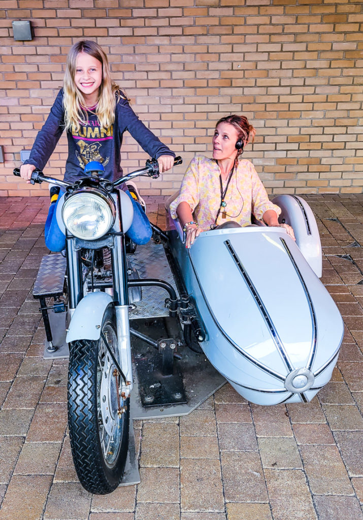 people sitting on a moterbike