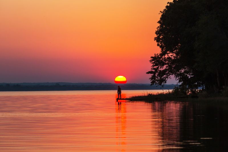 bright red sunset at lake peten itza guatemala