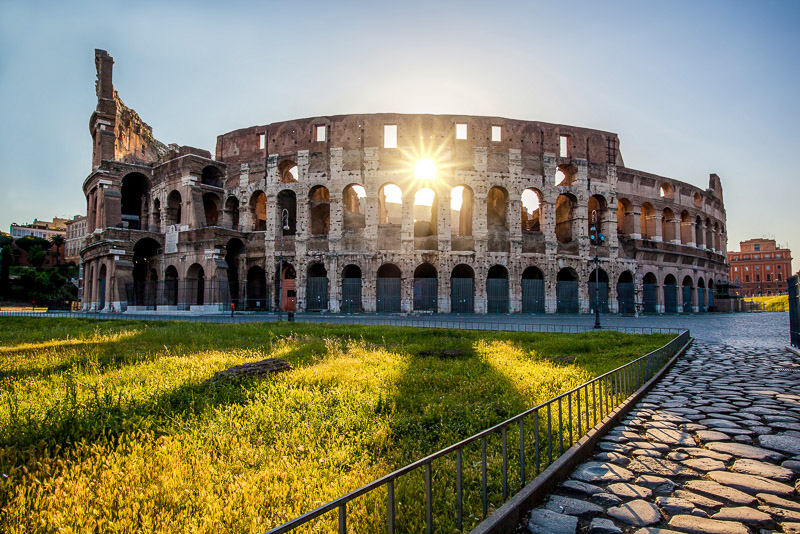 colosseum with sun burst