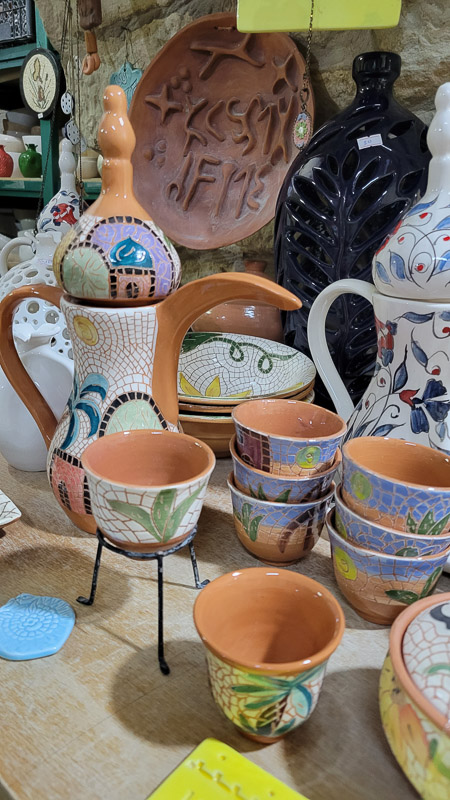 a table with bright pottery