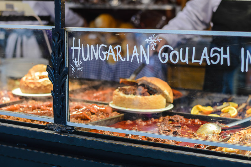 Goulash soup with beef, potato and meat sausage, served in a bread bowl on traditional Budapest food market