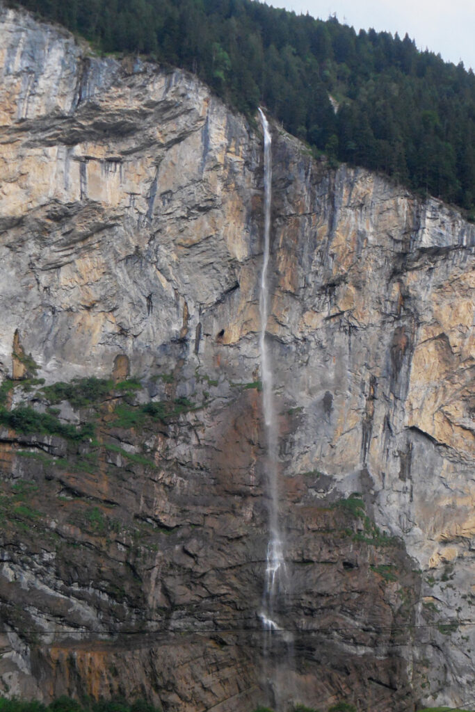 small waterfall coming down cliff face