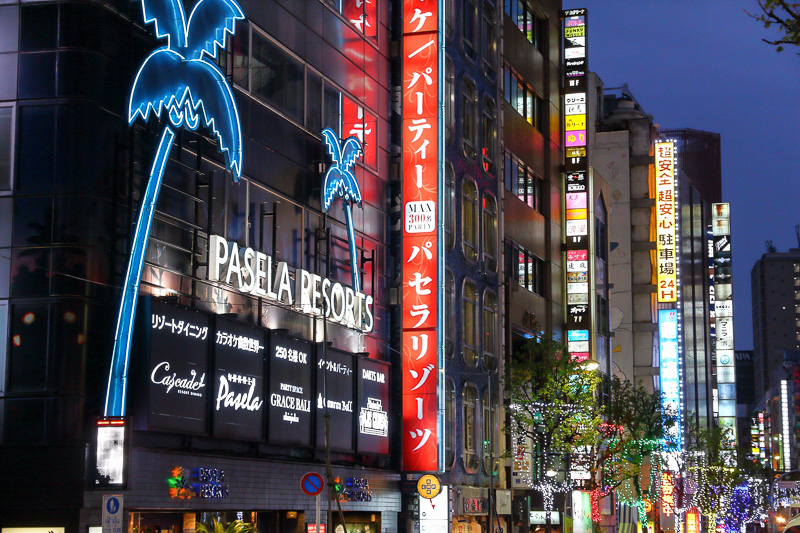 Outside building with neon Pasela Resorts sign