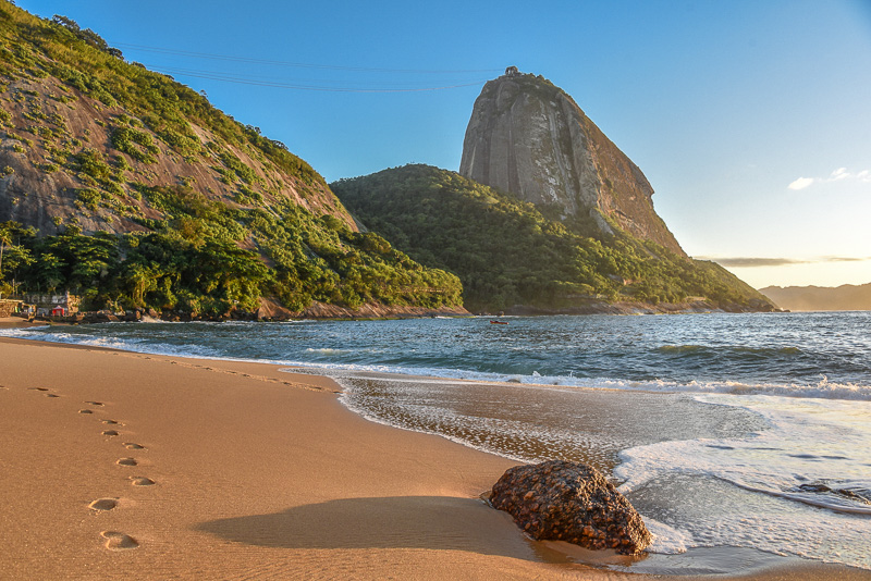 The empty Red beach Praia Vermelha and Sugarloaf mountain on the background at sunny morning, Rio de Janeiro, Brazil