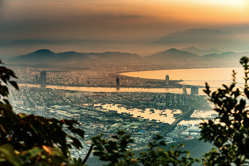 Da Nang City and Ba Na Mountains as seen from Ban Co Peak viewpoint at sunset, Vietnam.