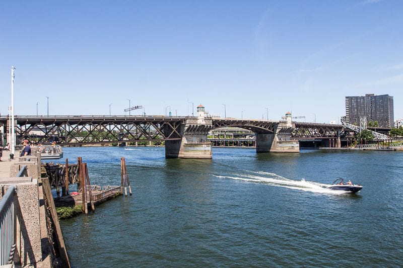 river with boats and a bridge