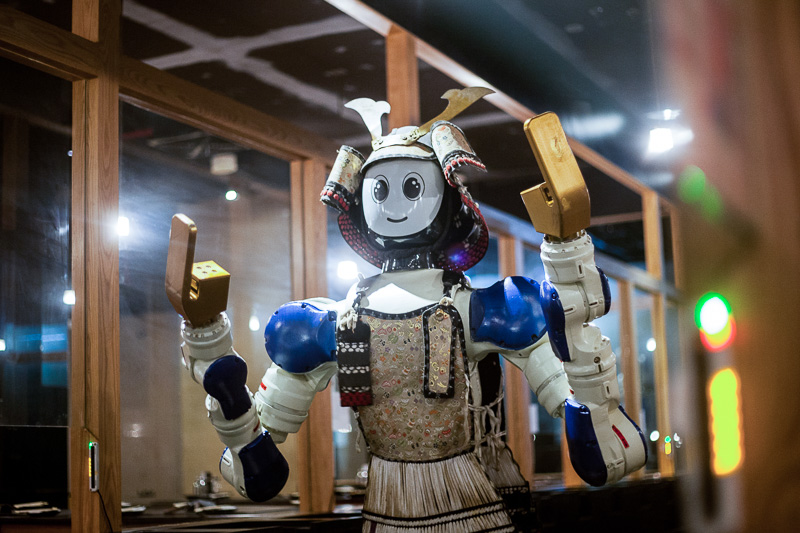  dancing robot waiter in a sushi bar