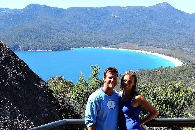 couple posing with view of Wineglass Bay, Tasmania