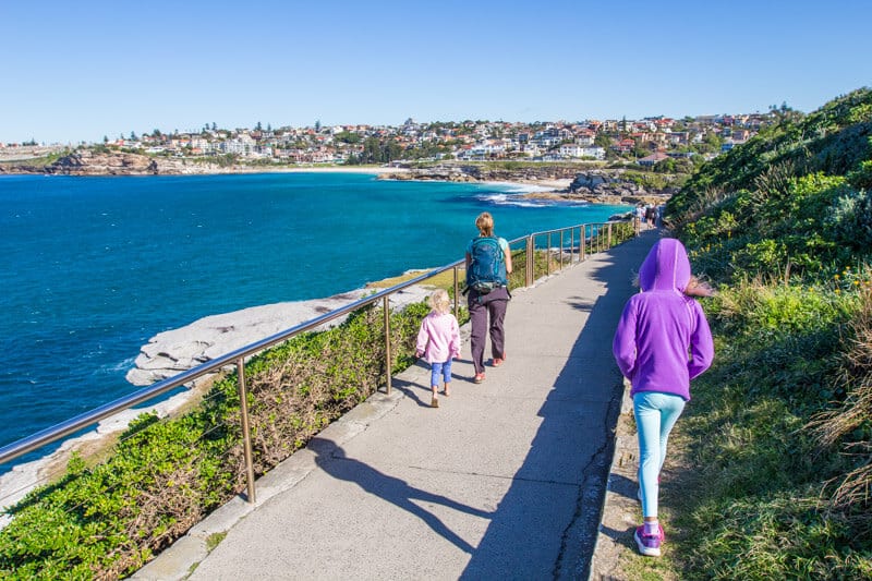 family walking along the coastal path  on Bondi Beach to Bronte Beach coastal walk.