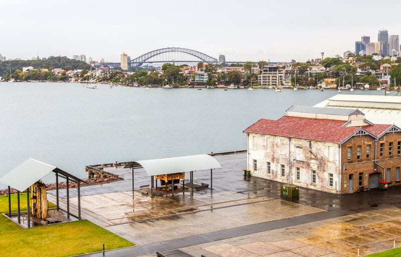 view of sydney harbor bridge next to a body of water