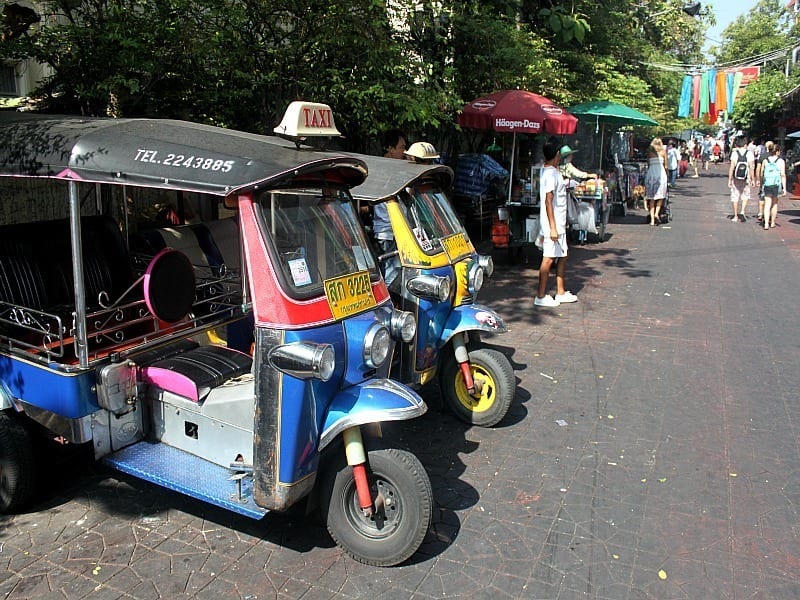 motorcycles parked on the side of a road