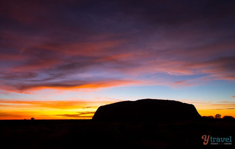 Sunrise silhouette of ayers rock