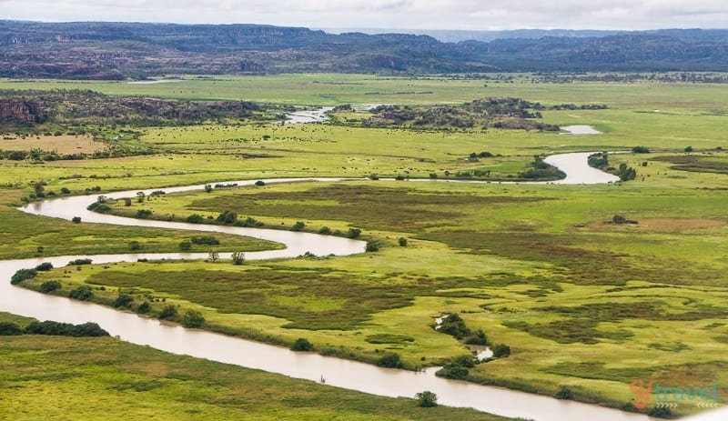 aerial views of adeliade river winding through lush landscape