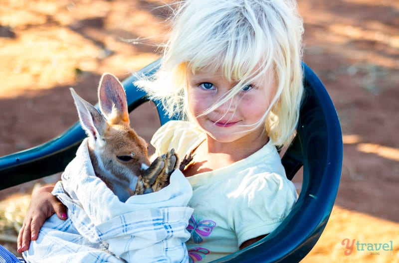 girl holding baby joey Kangaroo Sanctuary, Alice Springs