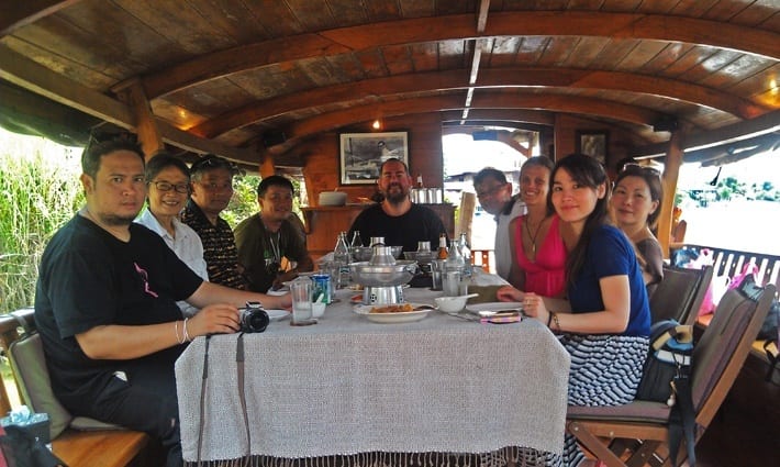 people sitting at table posing on Ayuttaya Boat cruise Thailand