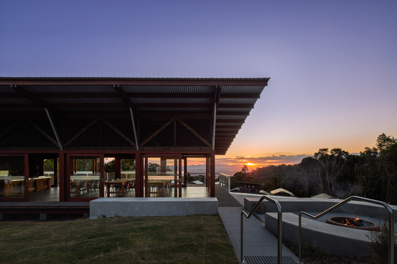 Communal kitchen and firepit at O'Reilly's Campground with the sunset over the Hinterland