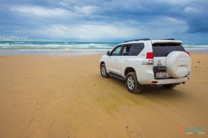 A car parked on a beach