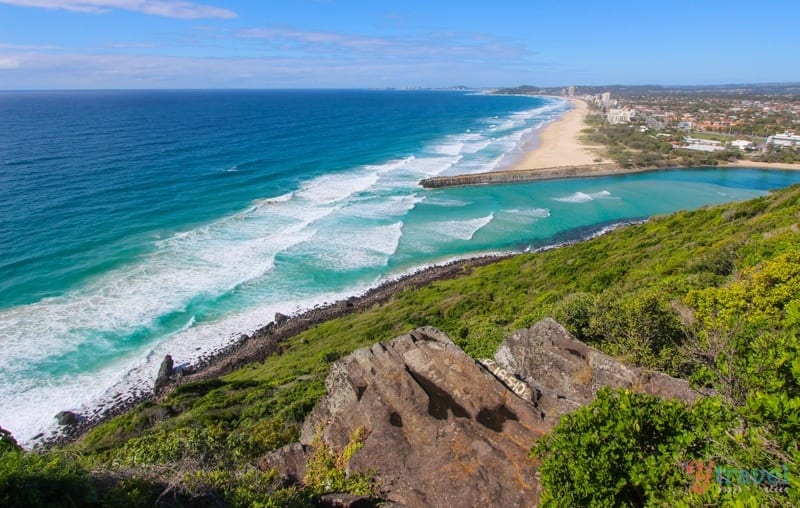 tallebudra creek spilling into ocean with pa,m beach on one side