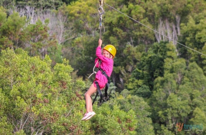 little girl on a zip line