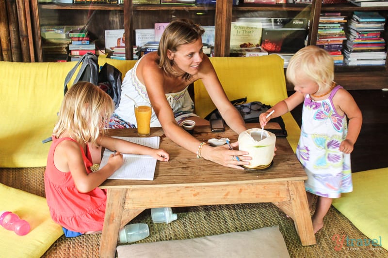 caz and the girls sitting at table drnking coconut water