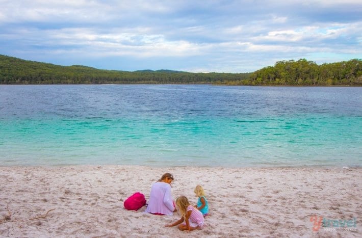 family playing on sand at Lake Mackenzie, 