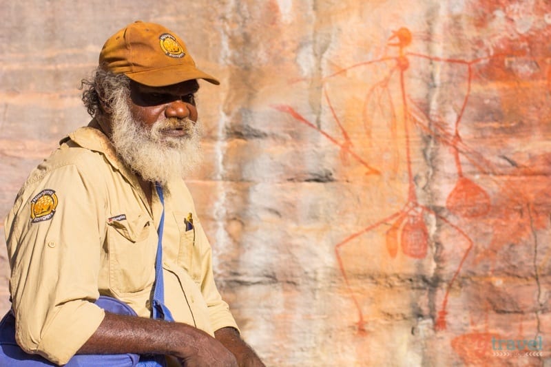 Traditional owner sharing stories in front of Ubirr Aboriginal Rock Art 