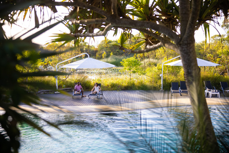 Couple by the resort swimming pool