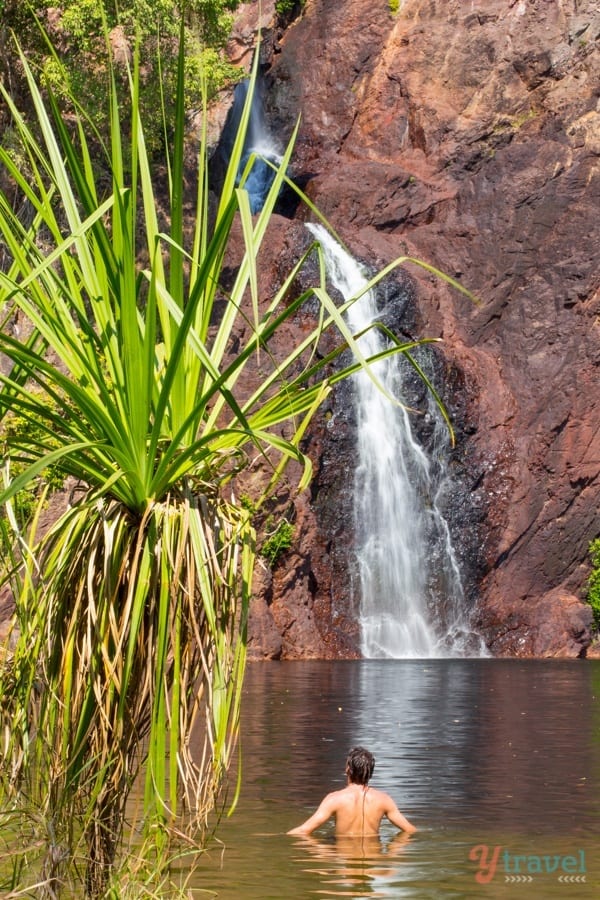 A large waterfall over some water