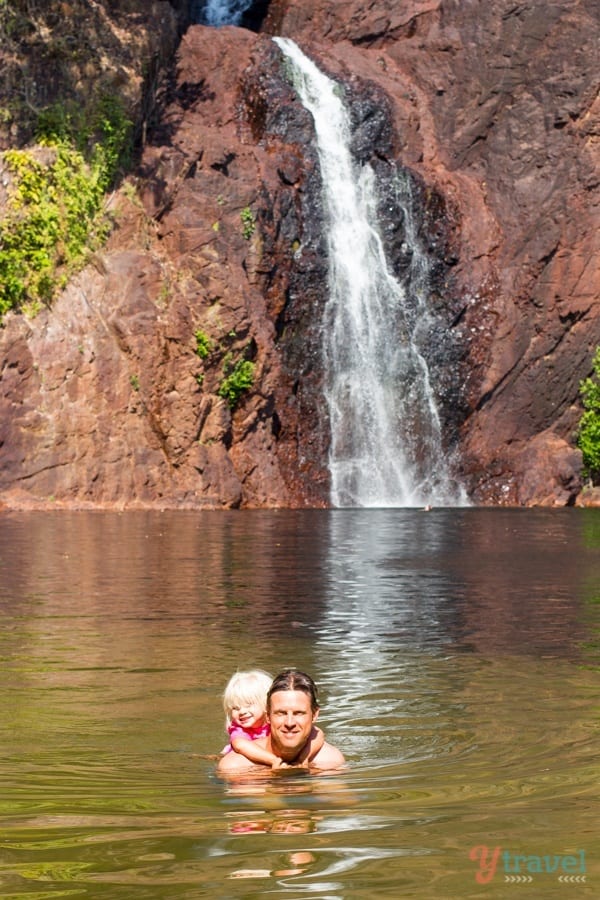 man and child swimming at Wangi Falls - 