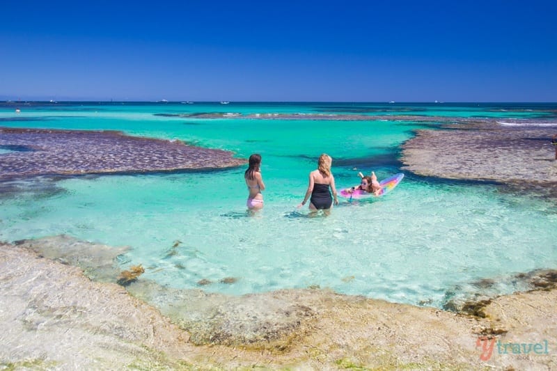 people swimming in the ocean