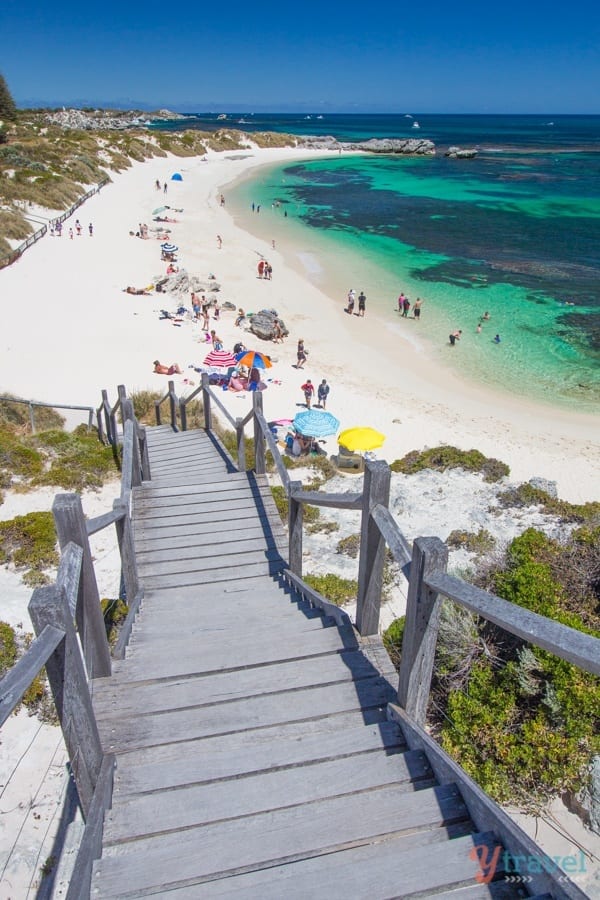 wooden stairs leading down onto a beach