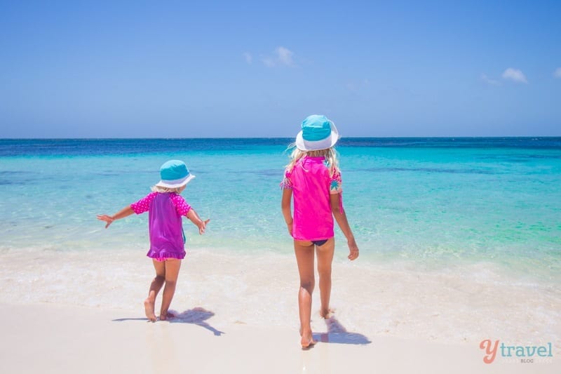 girls running into the water at Little Parakeet Bay