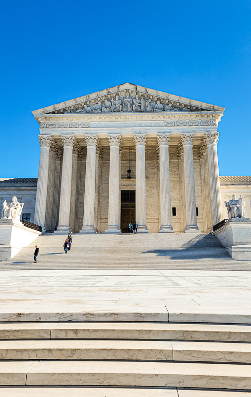 stairs leading up to the columned entrance of the supreme court