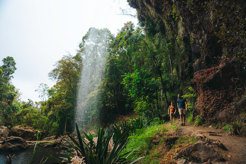 People hiking under twin falls on the warrie circuit