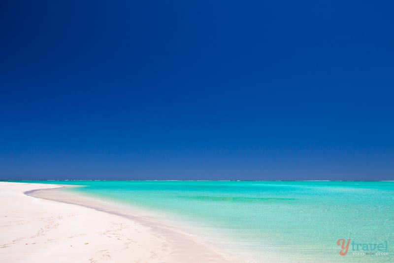 brilliant blue water and sky of Sandy Bay