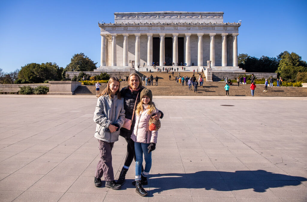 Mom and daughters looking out over the National Mall in DC