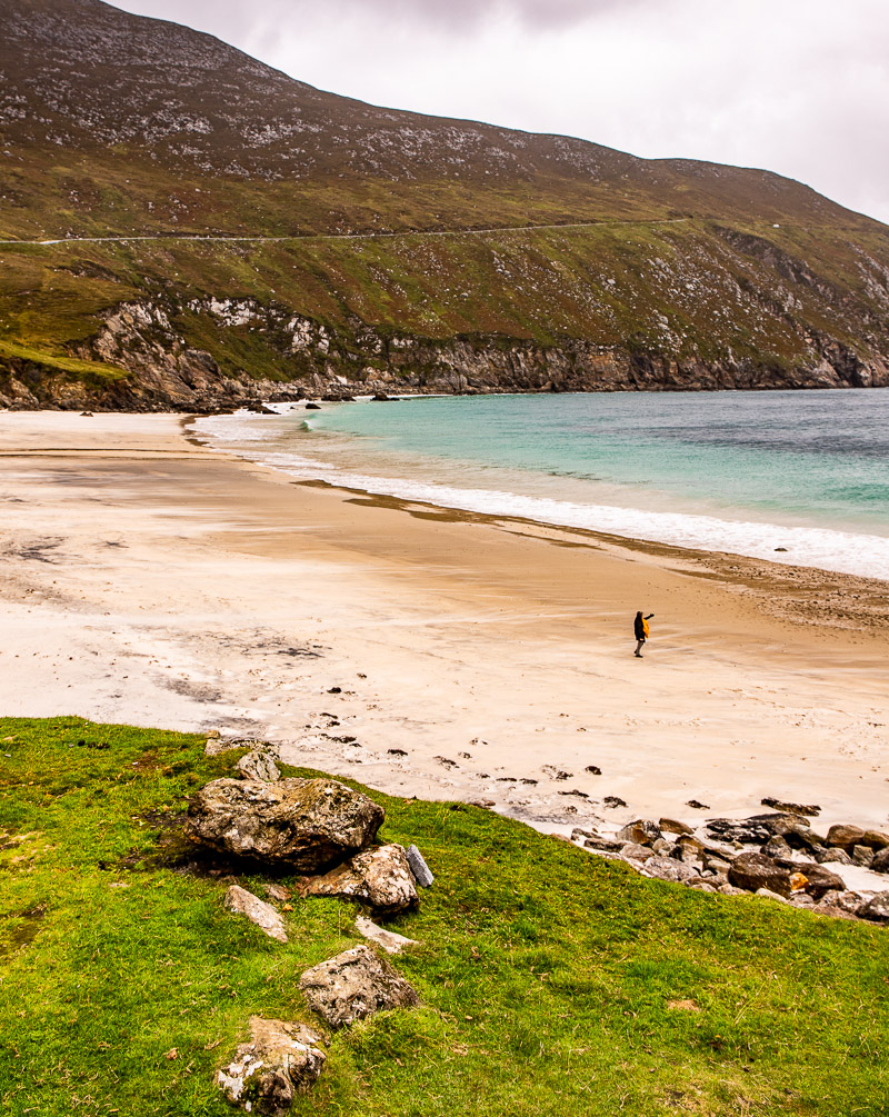 A beautiful beach with blue water and golden sand