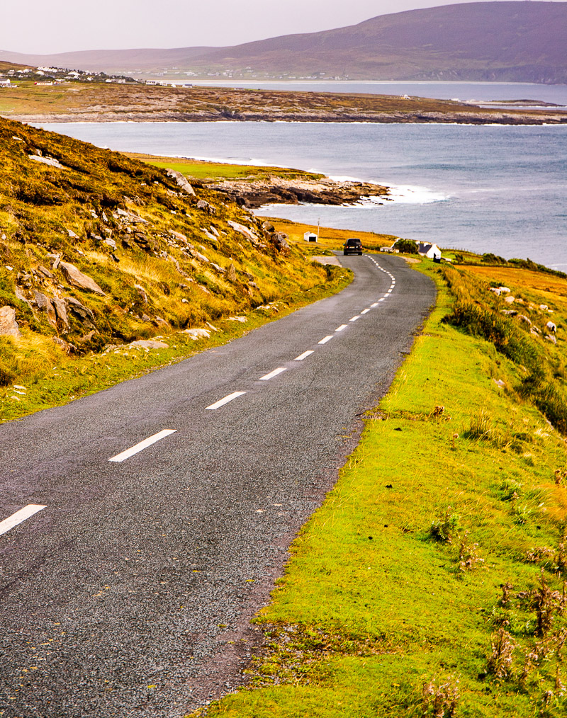 Coastal road sloping downhill towards the ocean