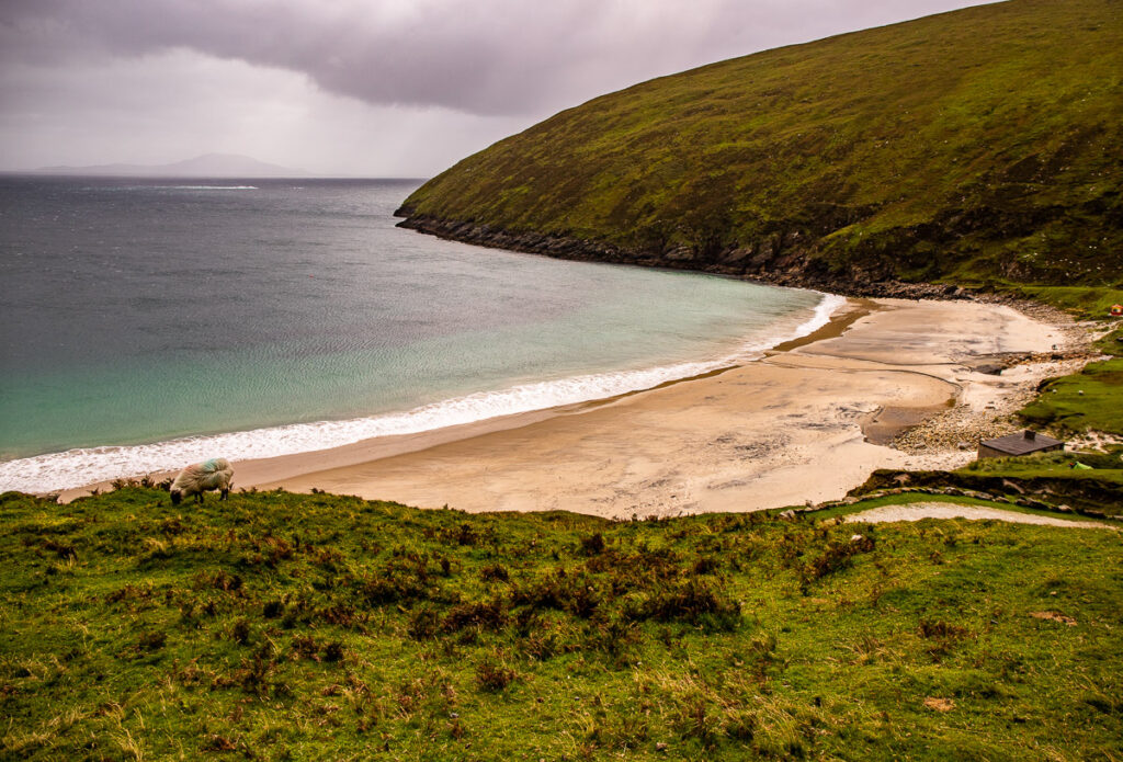 Bay of water and beach surrounded by mountains