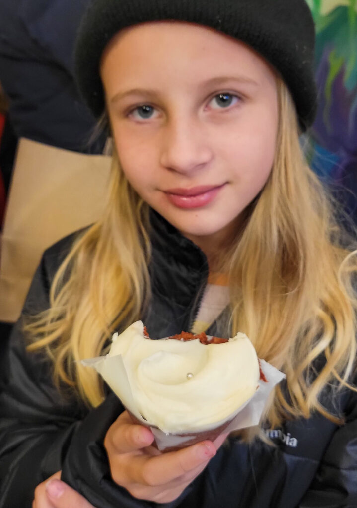 Girl eating a cupcake